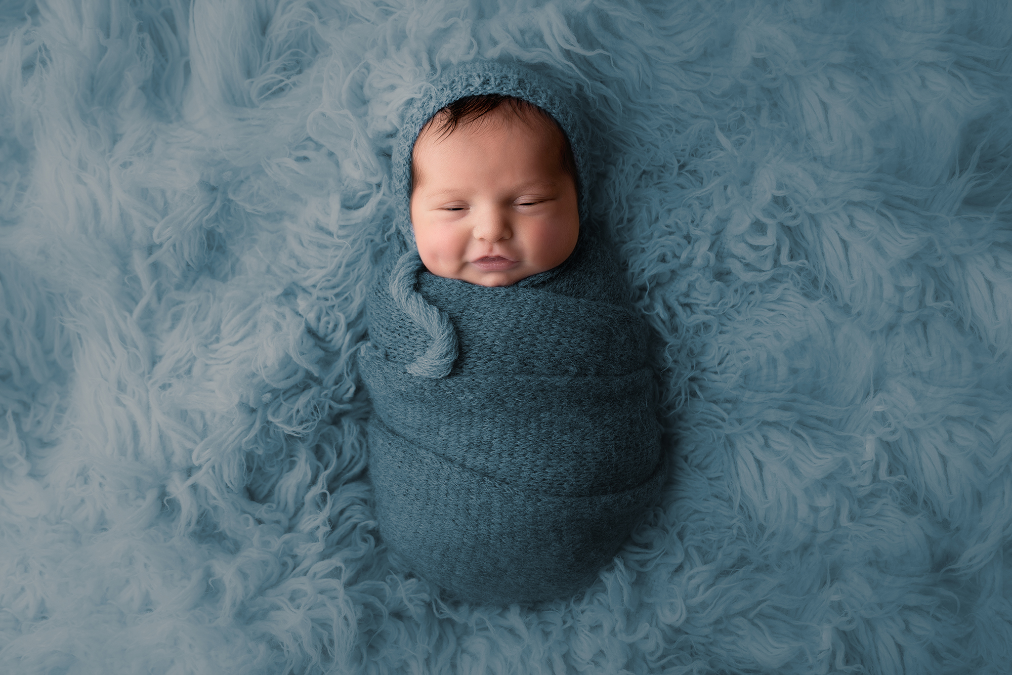 newborn baby in blue