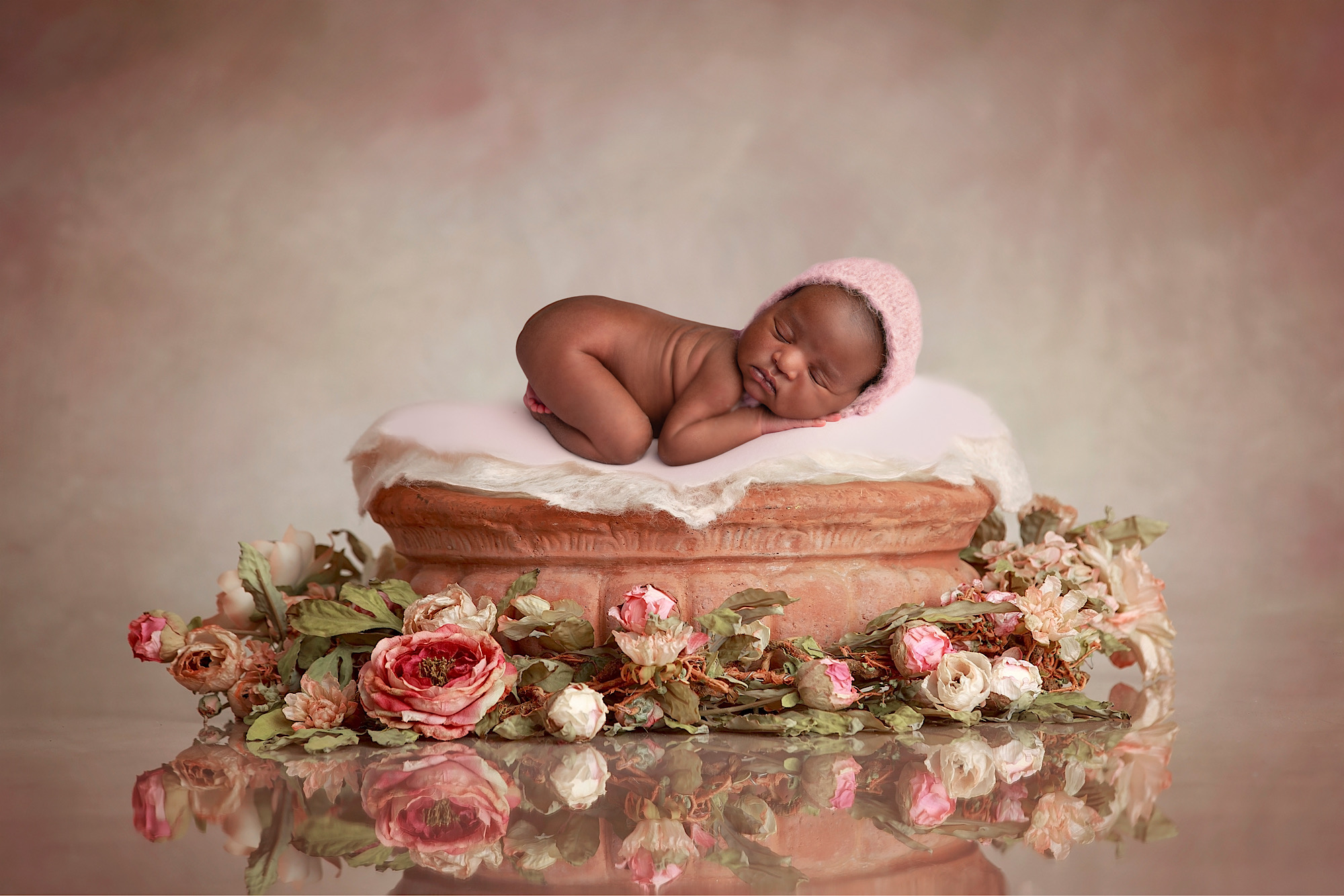 Newborn baby and flowers