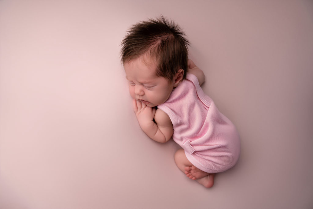 Newborn baby all cuddled up