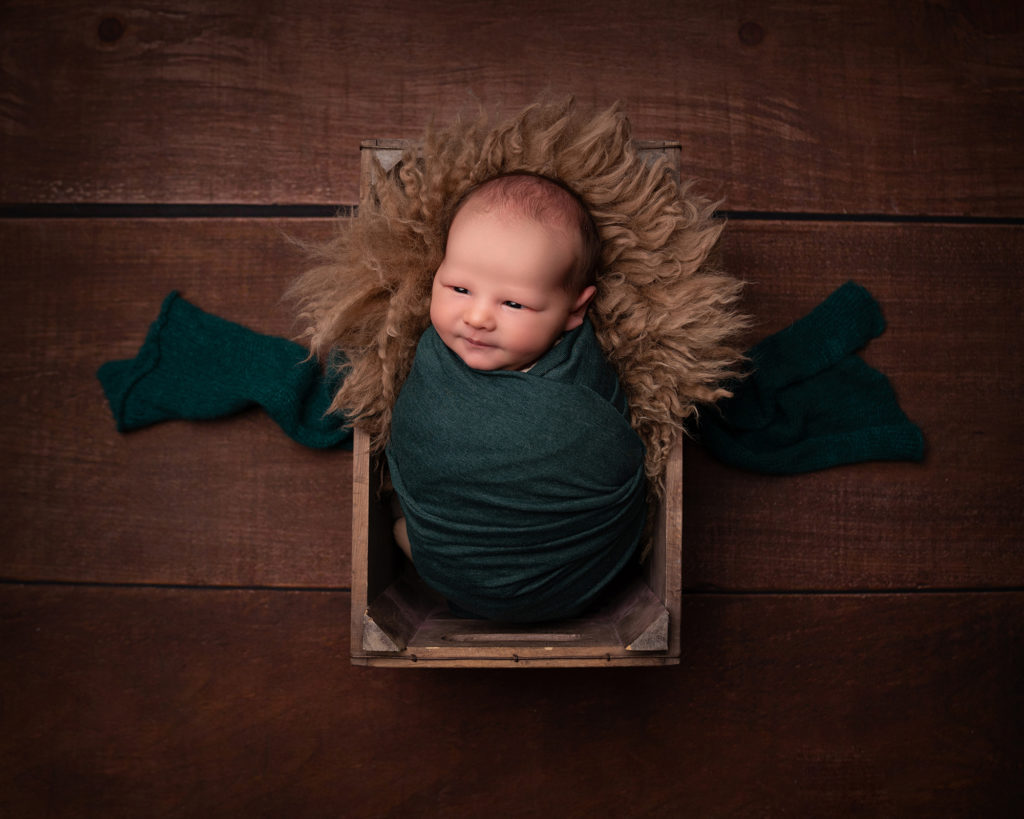 Wide-awake newborn baby during a photography session at Lisa Scott Photography in Rugby.
